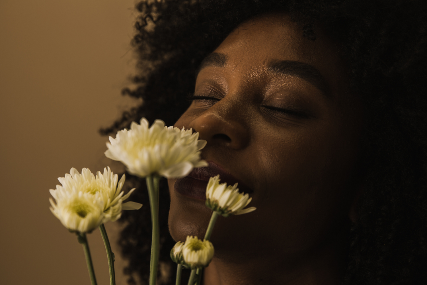 Mum smelling flowers